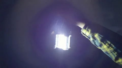 The lantern in the dungeon. The man goes a dark tunnel and holds a kaganets Stock Footage 234591788