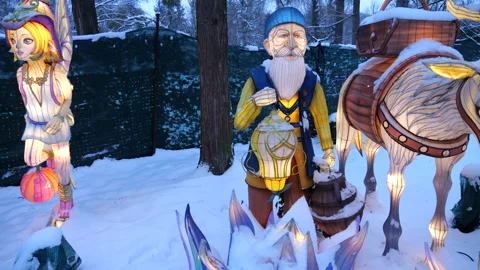 Lantern figures of an old man, elf with wings and a donkey glow brightly. 스톡 동영상 325869574