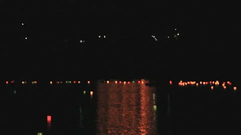 Lantern Floating at Hirosawa Pond and the Torii Shapes of the Gozan Fire Stock Footage 332477036