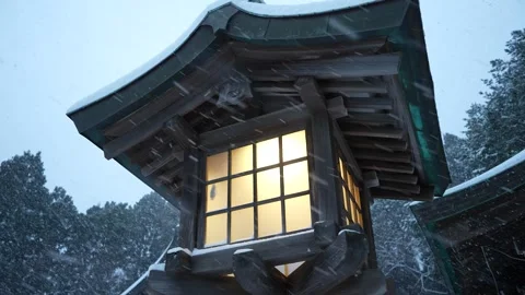 Lantern glowing in snowfall Close up in Hakodate Gokoku Shrine Hakodate Japan 動画素材 325631855