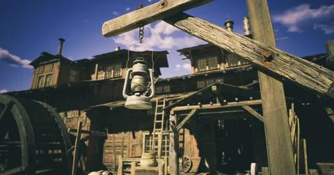 Lantern hanging in front of an old building with wooden architecture at sunse Ilustración de archivo