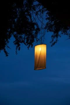 A lantern hanging on the tree Stock Photos