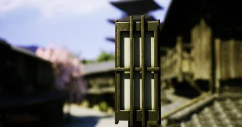 Lantern illuminates traditional architecture in an ancient village setting Ilustración de archivo