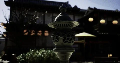 Lantern illuminates tranquil courtyard at historic Japanese location イラスト素材
