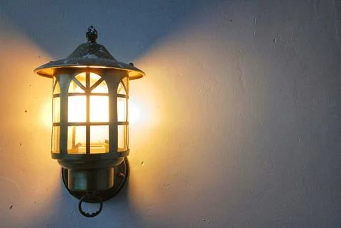 Lantern With A Lamp On White Wall Stock Photos