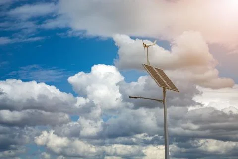 Lantern with a lantern and installed solar panels on a blue sky background. Foto stock