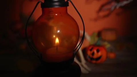 Lantern lifted away to reveal skeleton and pumpkin Halloween scene for part.. Vídeos de archivo 342378038