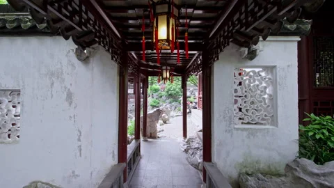 Lantern-Lit Corridor Leading to Traditional Chinese Garden Stock Footage 336782340