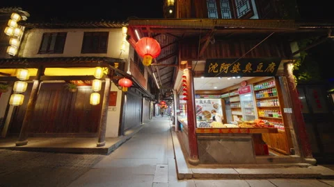 Lantern-Lit Night Street With Open Food Shop in Historic Zhouzhuang, China Stock Footage 337265874