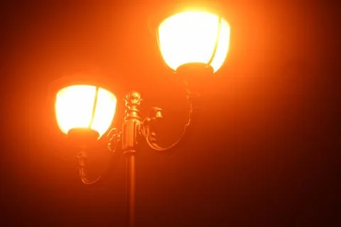 Lantern in the mist. Stock Photos