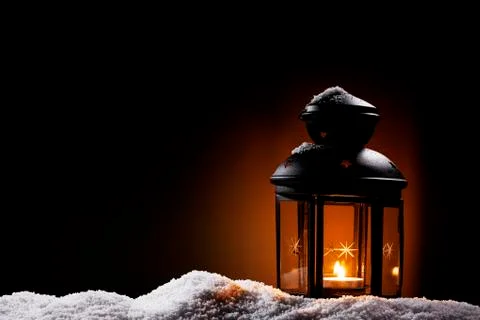 Lantern in the night on snow Stock Photos