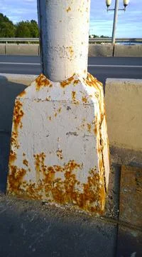 Lantern post metal corrosion. City road. Rust steel construction. Rusty messy Stock Photos