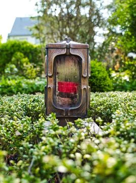 A lantern with a red candle in it 스톡 사진