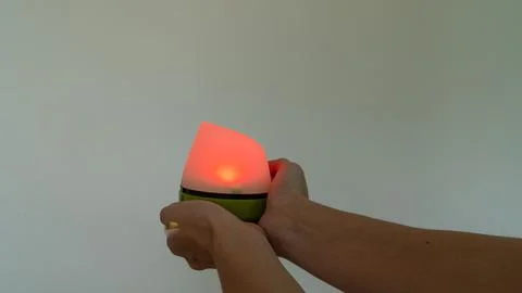 A lantern with a red light in its hands Stock Photos