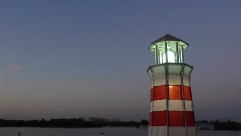The lantern of the river lighthouse flickers at dusk Stock Footage 137513985