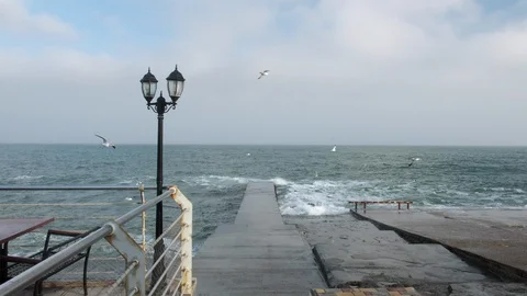 Lantern by the sea. Waves on the sea Stock Footage 103332991