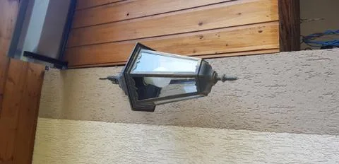 Lantern shaped lamp on the wall Stock Photos