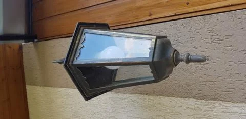 Lantern shaped lamp on the wall Stock Photos