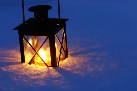 Lantern in snow Stock Photos