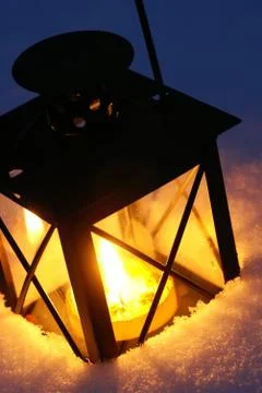 Lantern in snow Stock Photos