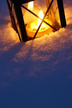 Lantern on snow Stock Photos
