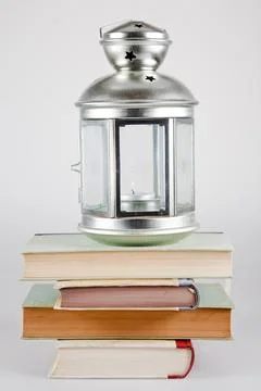 Lantern on stack of books Stock Photos