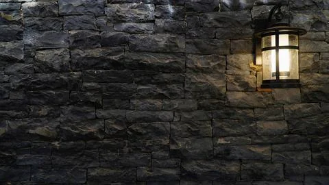 Lantern on a stone wall. old lantern .gray stone wall with lantern Stock Photos
