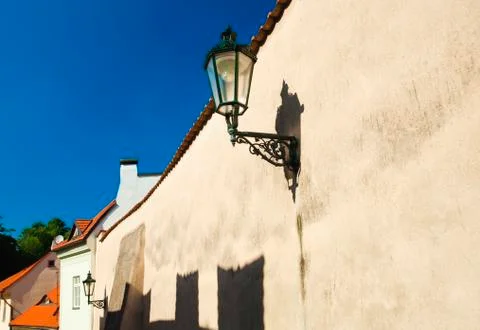 The lantern on the wall against the sky Stock Photos