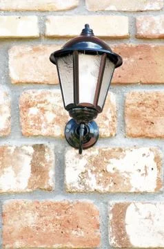 Lantern on the wall of the old brick Stock-Fotos