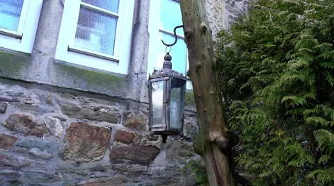 Lantern on wooden pillar in the wind 库存影片 61908024