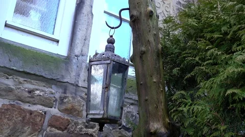 Lantern on wooden pillar in the wind Stock Footage 63086319