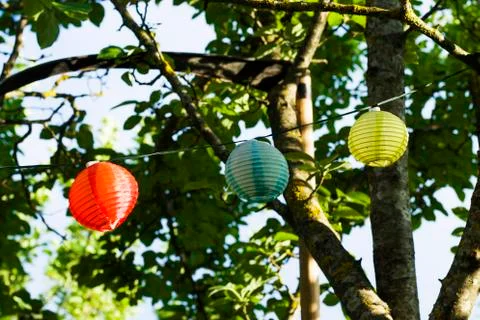 Lantern in the yard on the tree bokeh background, night and warm light, hangi Stock Photos