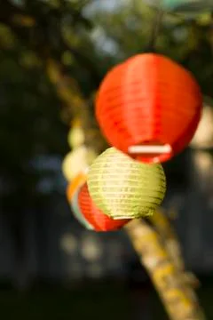 Lantern in the yard on the tree bokeh background, night and warm light, hangi Stock Photos