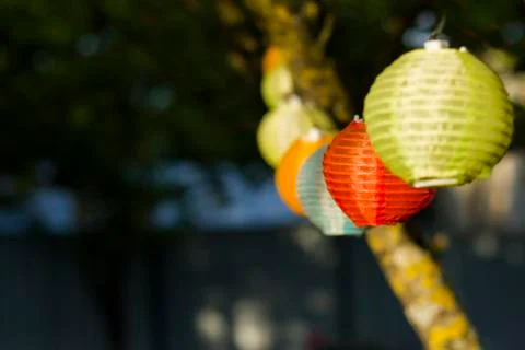 Lantern in the yard on the tree bokeh background, night and warm light, hangi Stock Photos