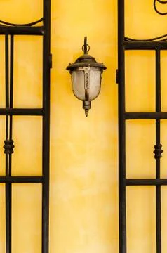 Lantern on a yellow wall Fotos de archivo