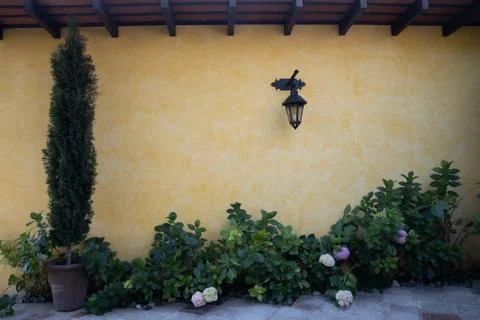 Lantern on yellow wall Stock Photos