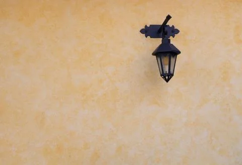 Lantern on yellow wall Stock Photos