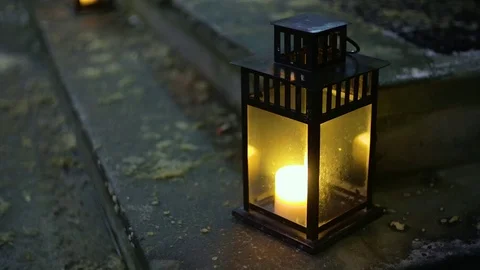 Lanterns with a candle standing on the steps Vídeos de archivo 71506817