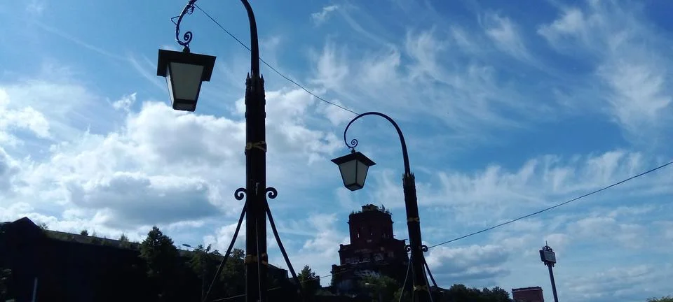 Lanterns with expressive clouds in the background Foto stock