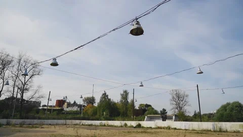 Lanterns hang on the wires above the old abandoned hockey field Stock Footage 305835092