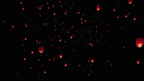 Lanterns isolated on transparent background. Floating lanterns in the sky. Stock Footage 232860070