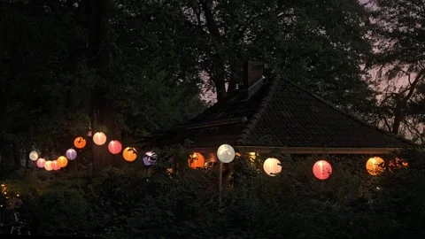 With Lanterns Lit Restaurant In The Evening On A Summer Day Stock Footage 276546751