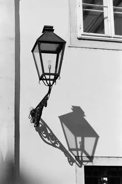 Lantern's shadow on the wall. Stock Photos