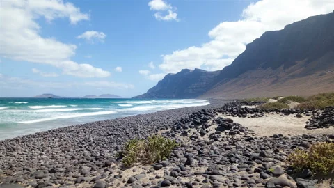 Lanzarote Beach time lapse with passing clouds and waves Stock Footage 233746771