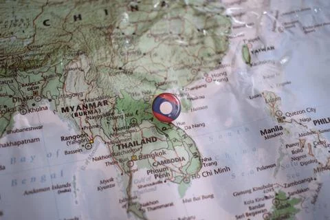 Laos flag drawing pin on the map Stock Photos