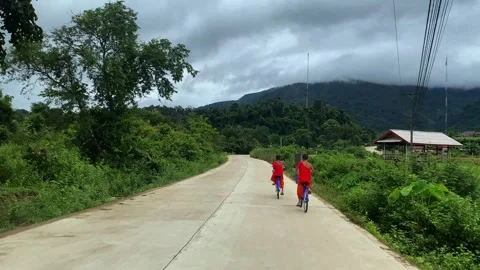 Laos YoungMonks Bicycle Stock-Footage 314746895