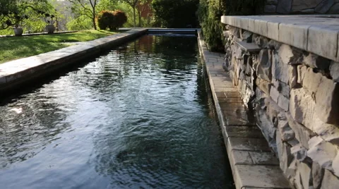 LAP POOL AND WATER FEATURE TURNING ON (TIGHTEST) Stock Footage 67638608