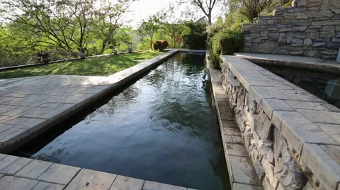 LAP POOL WATER FEATURE TURNING ON AND OFF - WIDE Vídeos de archivo 67639193