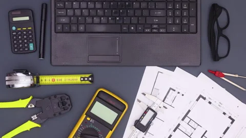 Lap top, architecture and construction tools move on work table Stop motion Stock Footage 138849852