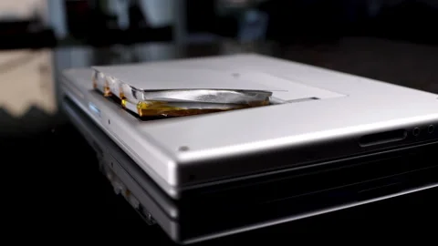 Lap top battery exploded. Lithium battery expanded and under pressure.  Stock Footage 263943514